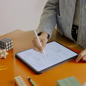 Paperlike 2.1 matte screen protector on iPad 10.2, used with Apple Pencil for note taking on a desk