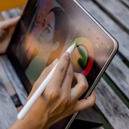 Paperlike paper-like screen protector on an iPad with stylus, showing a digital color picker interface.